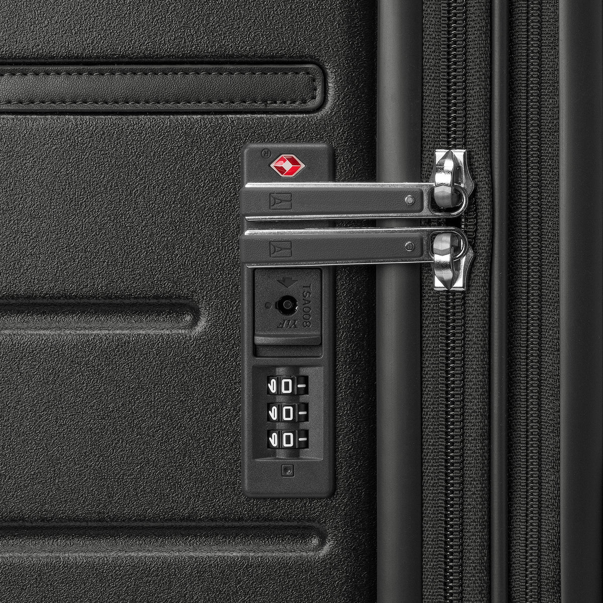 Close-up of the built-in TSA lock on the Travelpro Platinum Reserve Compact Carry-On Hardside Spinner in Black Dust
