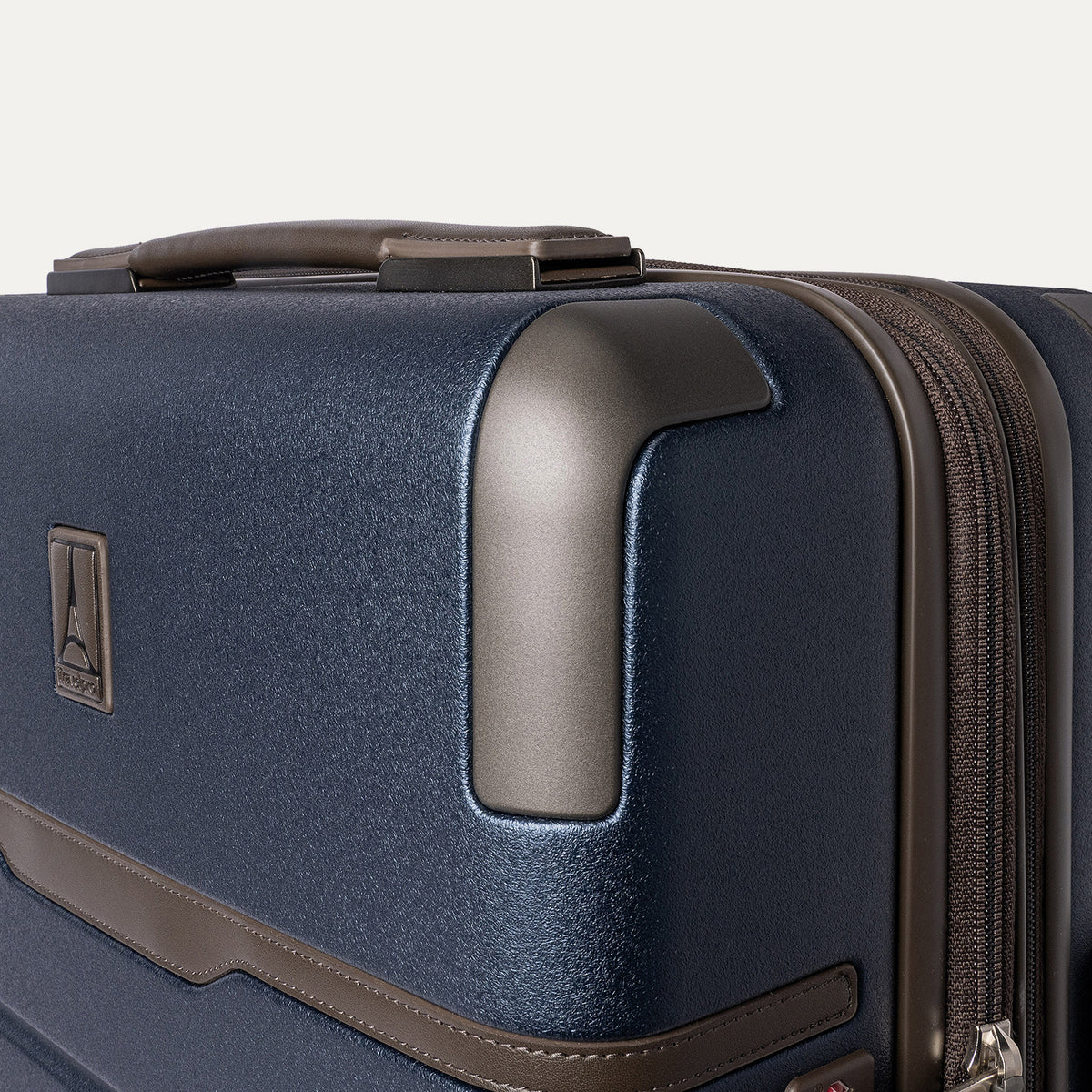 Close-up of the zinc corner armor on the Travelpro Platinum Reserve Compact Carry-On Hardside Spinner in Midnight Trail