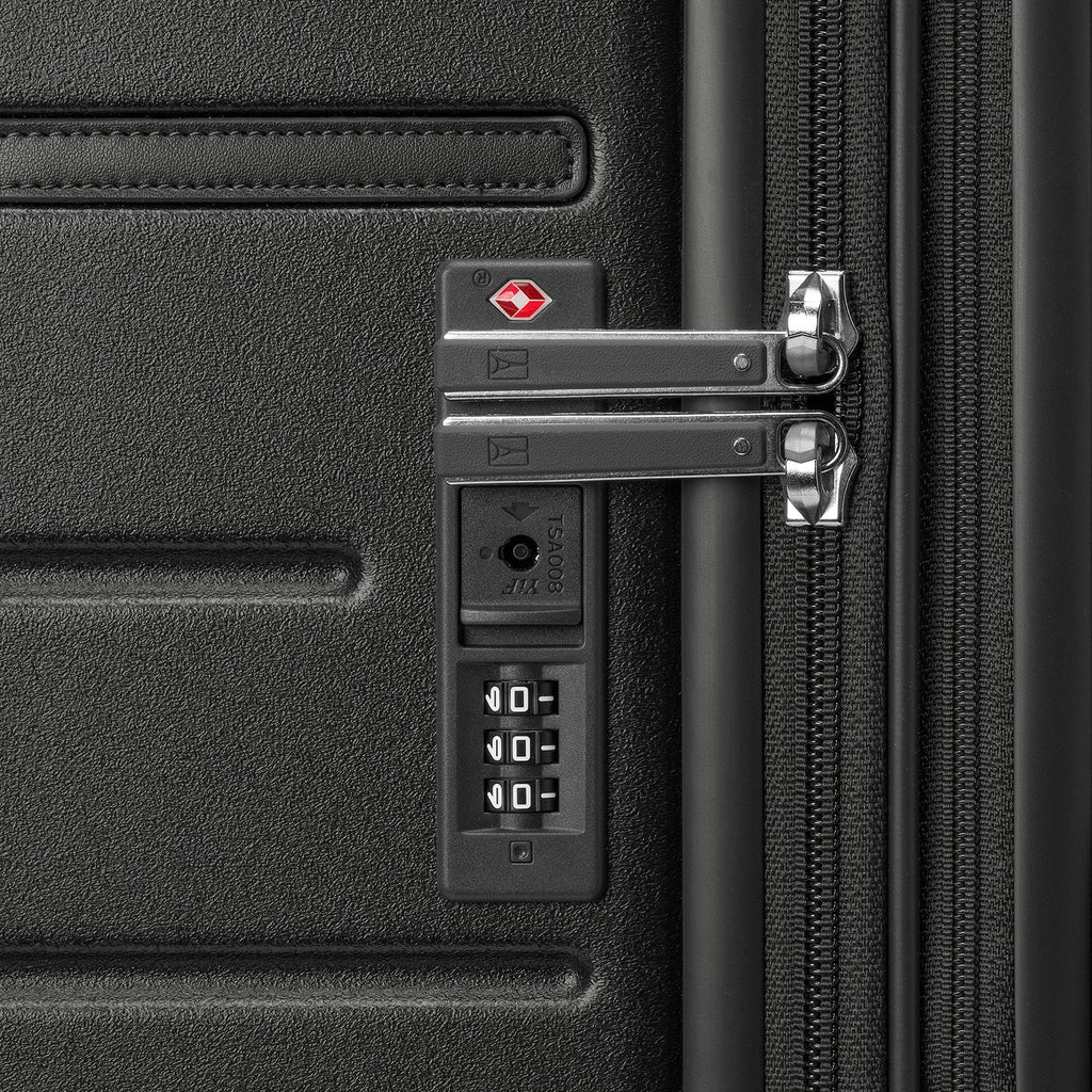 Close-up of the built-in TSA lock on the Travelpro Platinum Reserve Carry-On Hardside Spinner in Black Dust