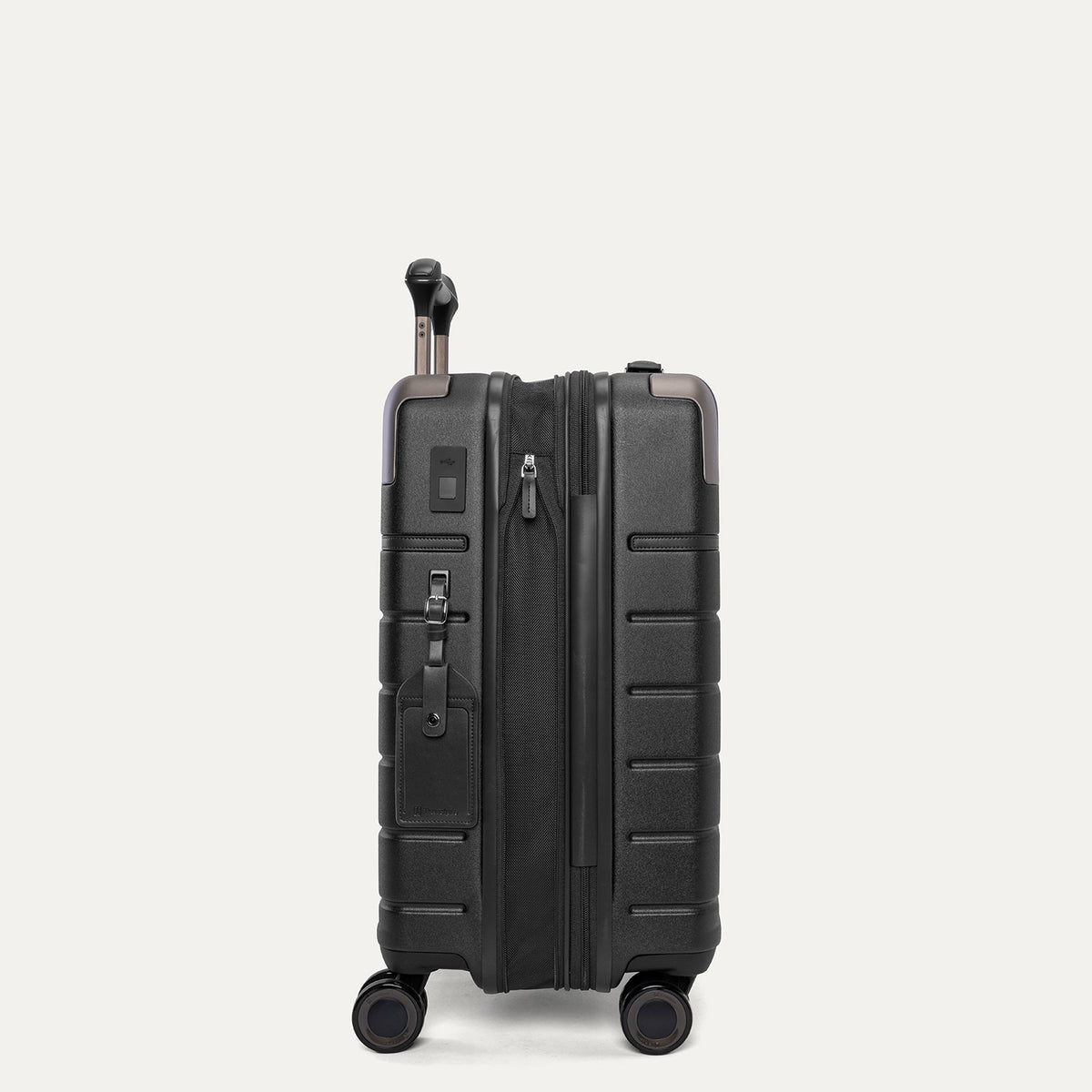 Side profile of the Travelpro Platinum Reserve Carry-On Hardside Spinner in Black Dust, expanded for extra packing space