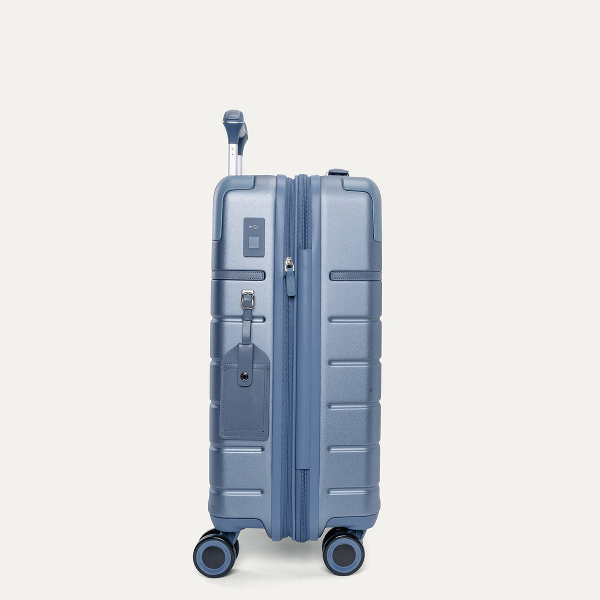 Side profile of the Travelpro Platinum Reserve Carry-On Hardside Spinner in Steel Blue