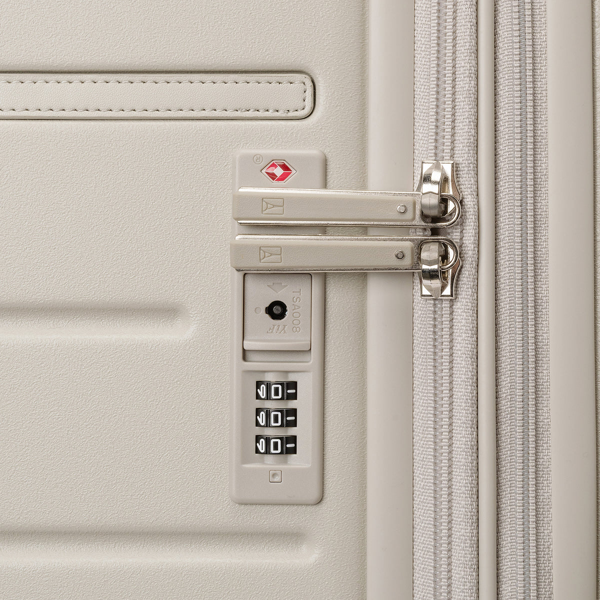 Close-up of the built-in TSA lock on the Travelpro Platinum Reserve Carry-On Hardside Spinner in Sandstone