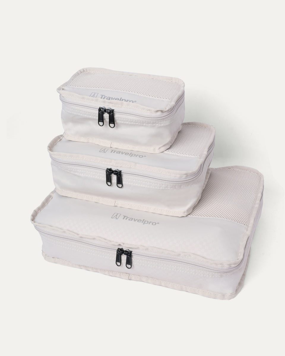 Packing cubes included with the Travelpro Platinum Reserve Carry-On Hardside Spinner in Midnight Trail, stacked by size