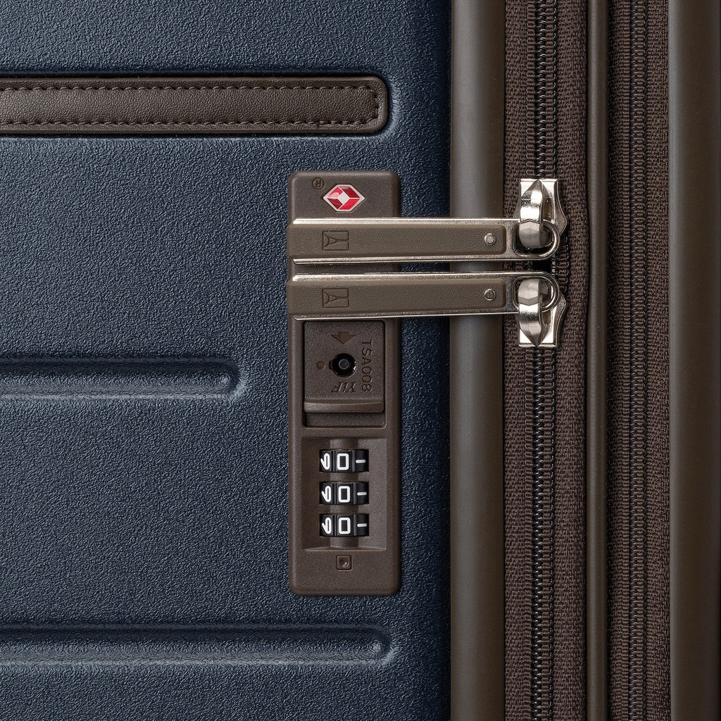 Close-up of the built-in TSA lock on the Travelpro Platinum Reserve Carry-On Hardside Spinner in Midnight Trail