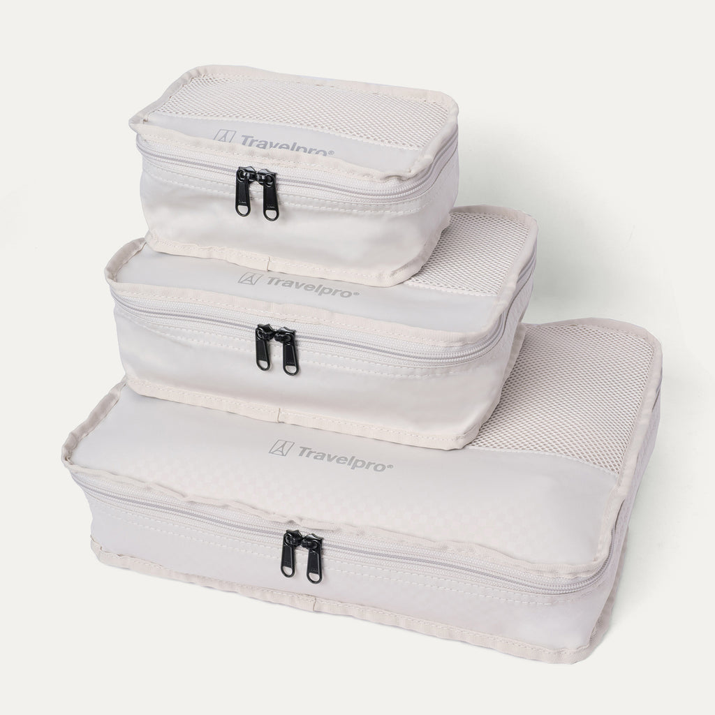 Packing cubes included with the Travelpro Platinum Reserve Carry-On Hardside Spinner in Midnight Trail, stacked by size