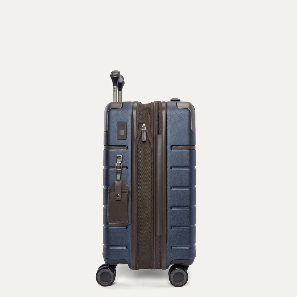 Side profile of the Travelpro Platinum Reserve Carry-On Hardside Spinner in Midnight Trail, expanded for extra packing space
