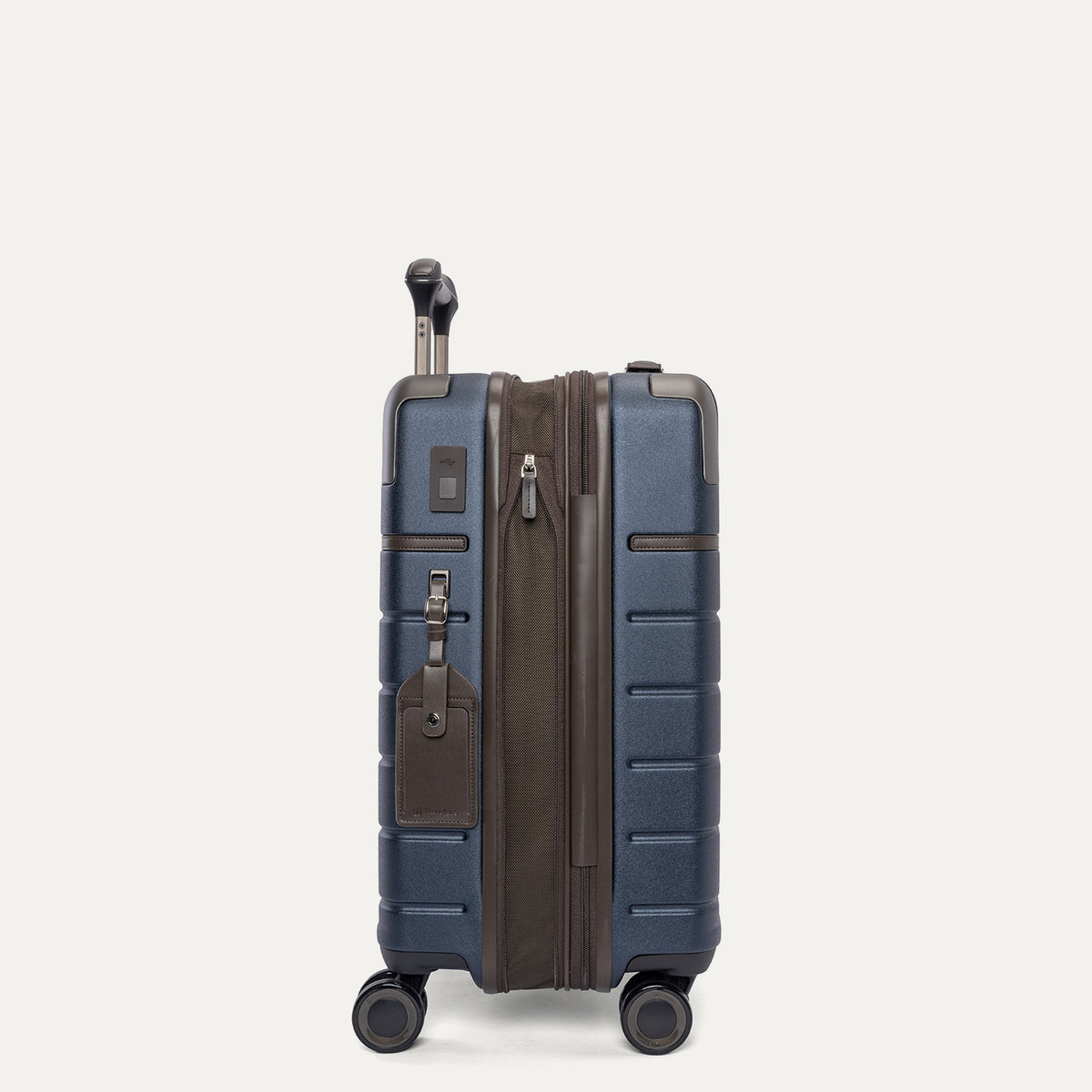 Side profile of the Travelpro Platinum Reserve Carry-On Hardside Spinner in Midnight Trail, expanded for extra packing space