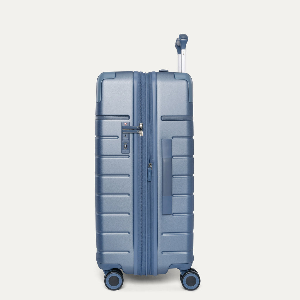 Side profile of the Travelpro Platinum Reserve Medium Check-In Hardside Spinner in Steel Blue