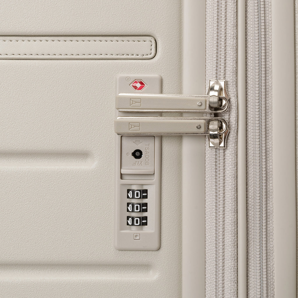 Close-up of the built-in TSA lock on the Travelpro Platinum Reserve Medium Check-In Hardside Spinner in Sandstone