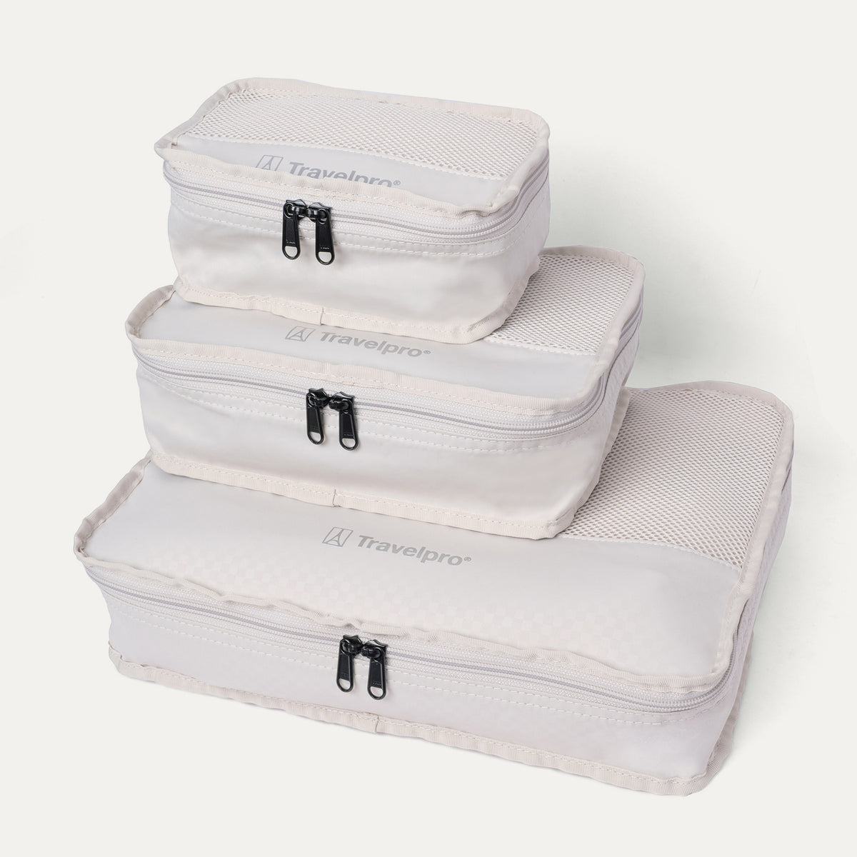 Packing cubes included with the Travelpro Platinum Reserve Medium Check-In Hardside Spinner in Midnight Trail, stacked by size