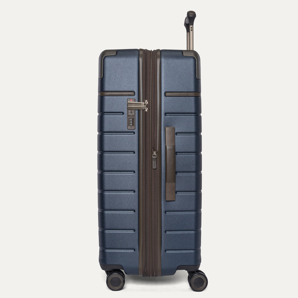 Side profile of the Travelpro Platinum Reserve Large Check-In Hardside Spinner in Midnight Trail