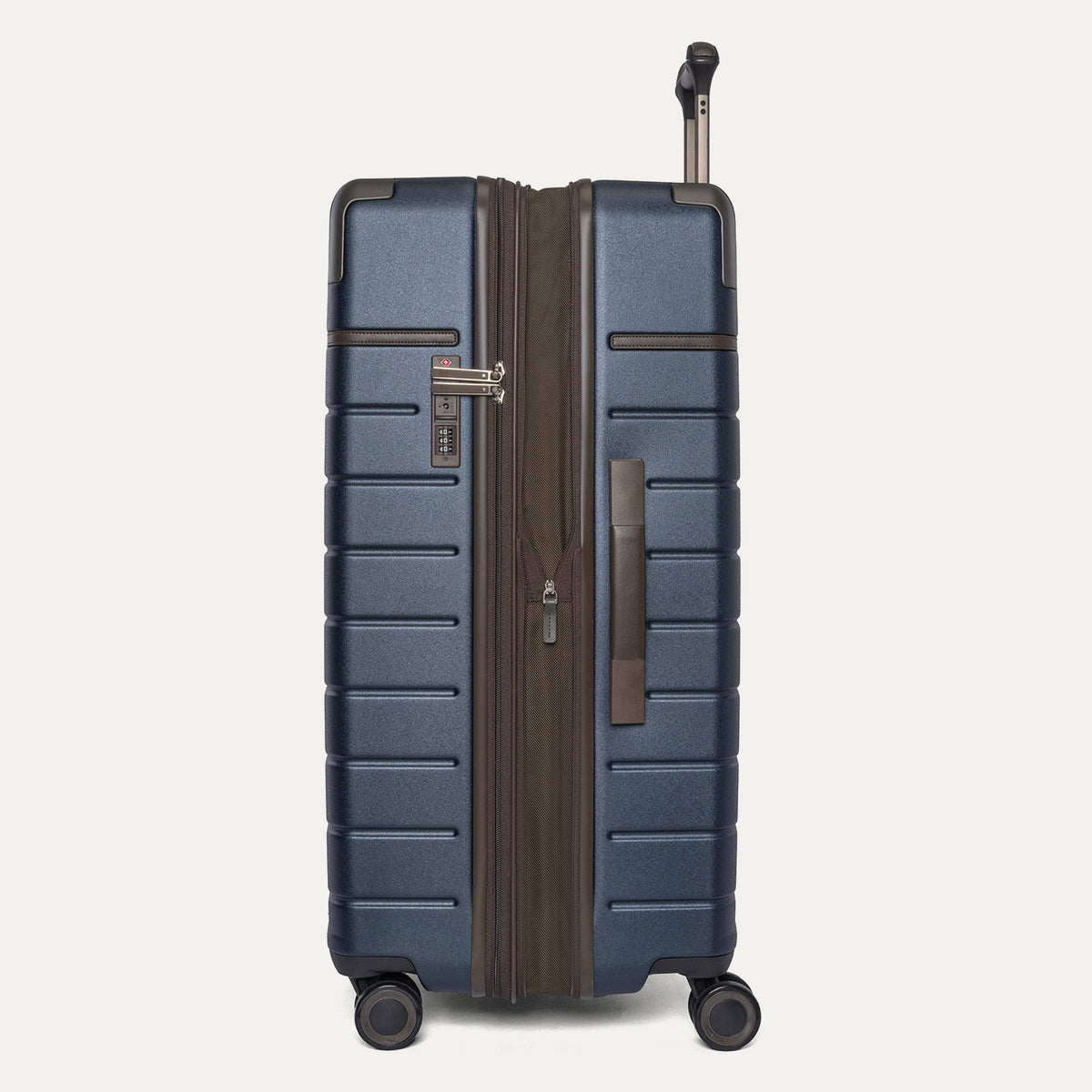 Side profile of the Travelpro Platinum Reserve Large Check-In Hardside Spinner in Midnight Trail, expanded for extra packing space