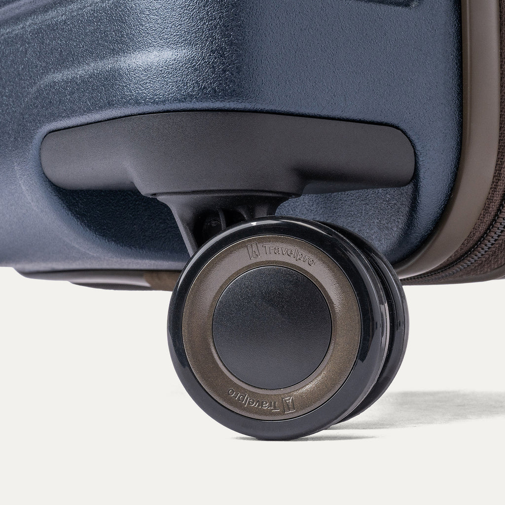 Close-up of a MagnaTrac self-aligning spinner wheel on the Travelpro Platinum Reserve Large Check-In Hardside Spinner in Midnight Trail