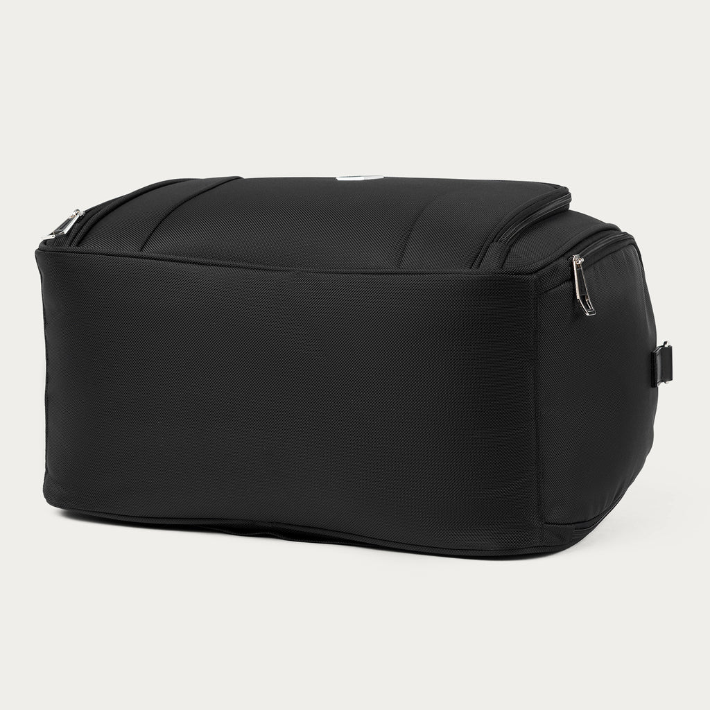Bottom view of the black Travelpro Runway Tote against an off-white background.