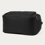 Bottom view of the black Travelpro Runway Tote against an off-white background.