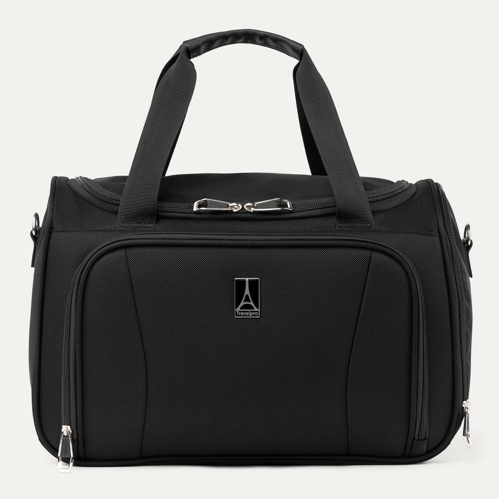 Front view of the Travelpro Runway Tote in Black, showcasing dual top grab handles, a front zippered pocket with the Travelpro logo badge, and side attachments for the shoulder strap against a clean off-white background.