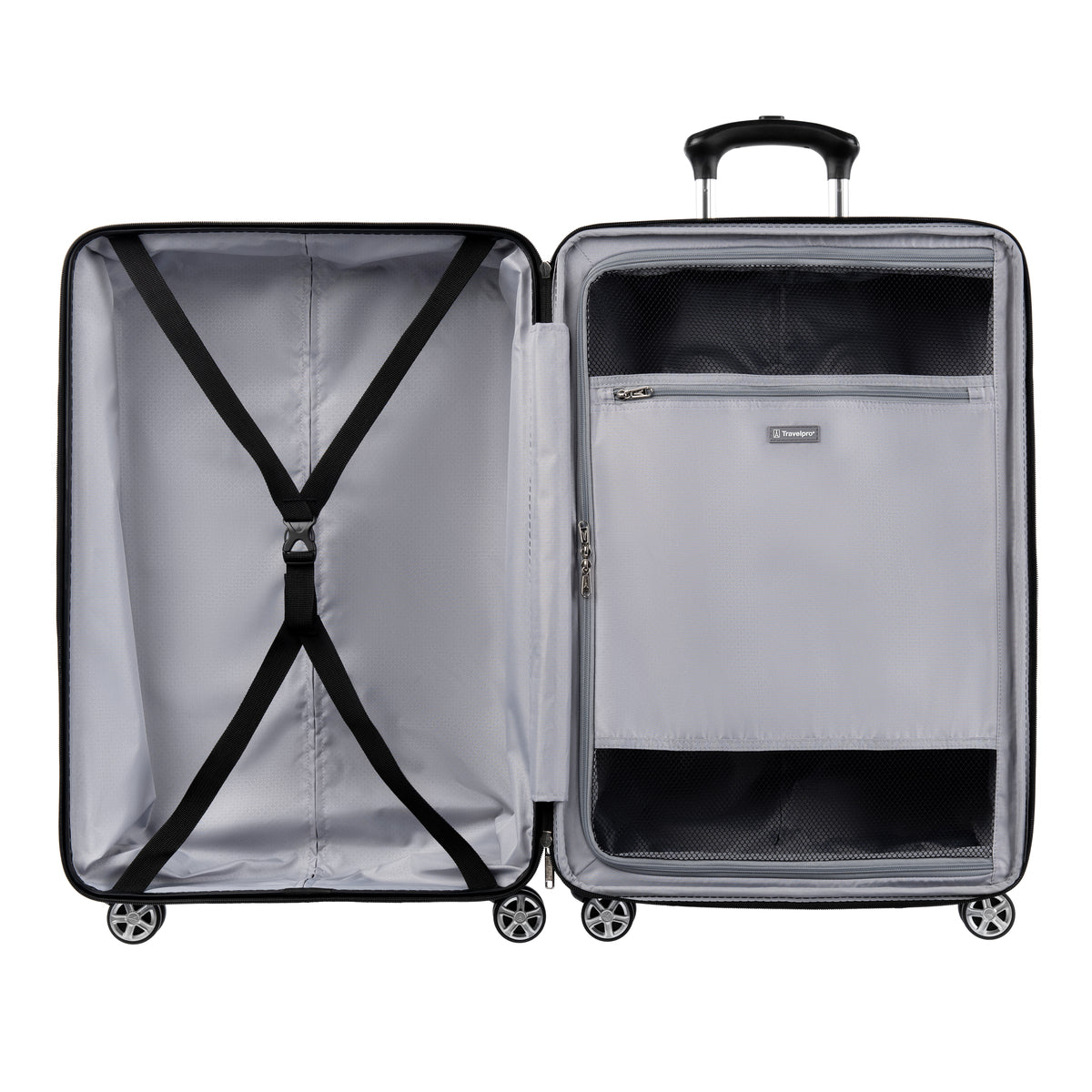 Interior view of an open large hardshell spinner suitcase, showing two compartments one with adjustable cross straps and the other with a zippered mesh divider containing an additional zip pocket.