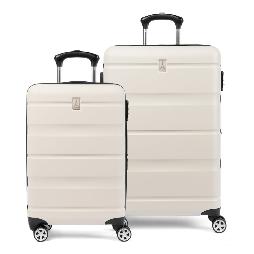 Front view of white Travelpro Runway carry-on and check-in hardside spinners with telescoping handles.
