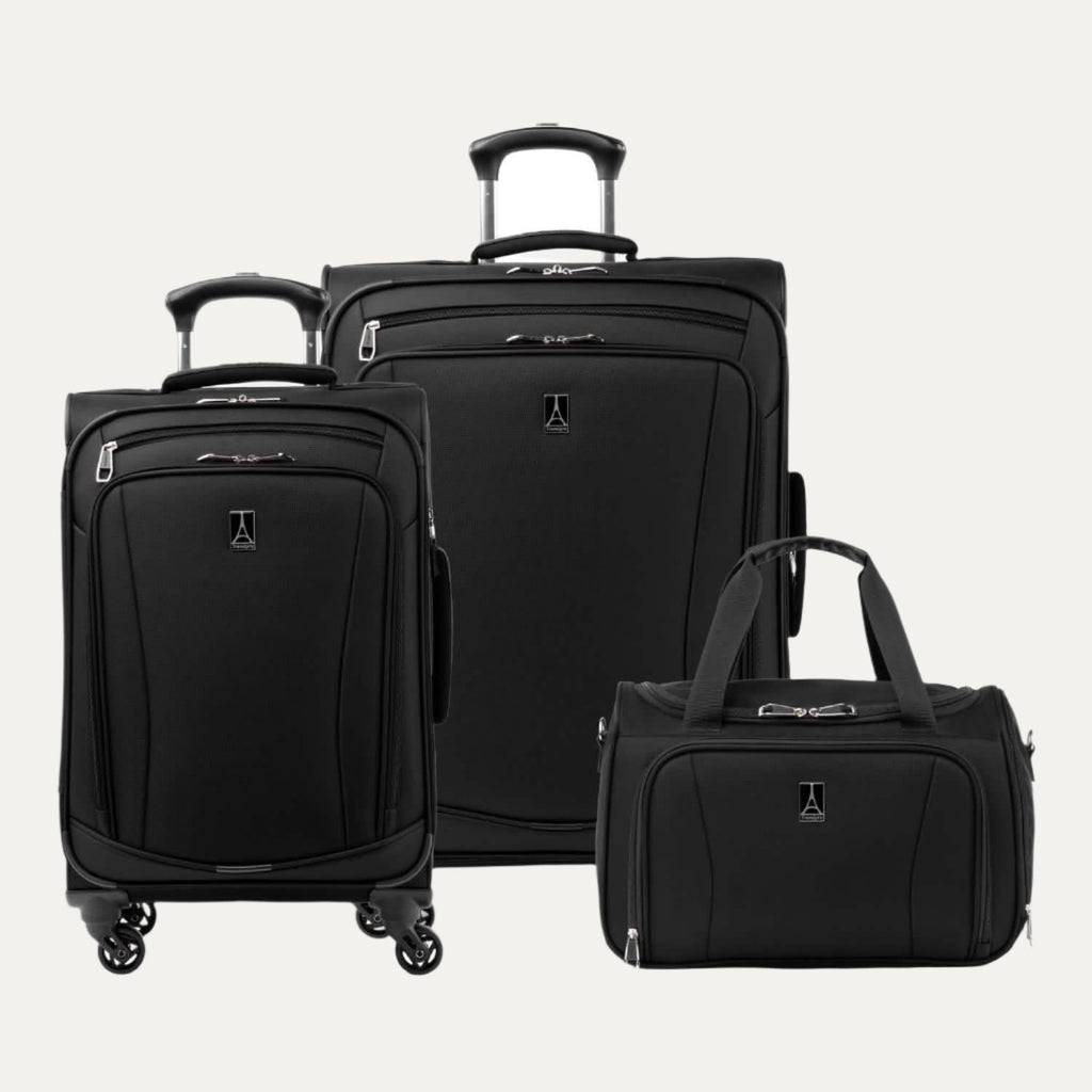 Runway 3-Piece Luggage Set in black, featuring an underseat soft tote, a carry-on spinner, and a convertible medium-to-large checked spinner suitcase, all with the Travelpro logo on the front.
