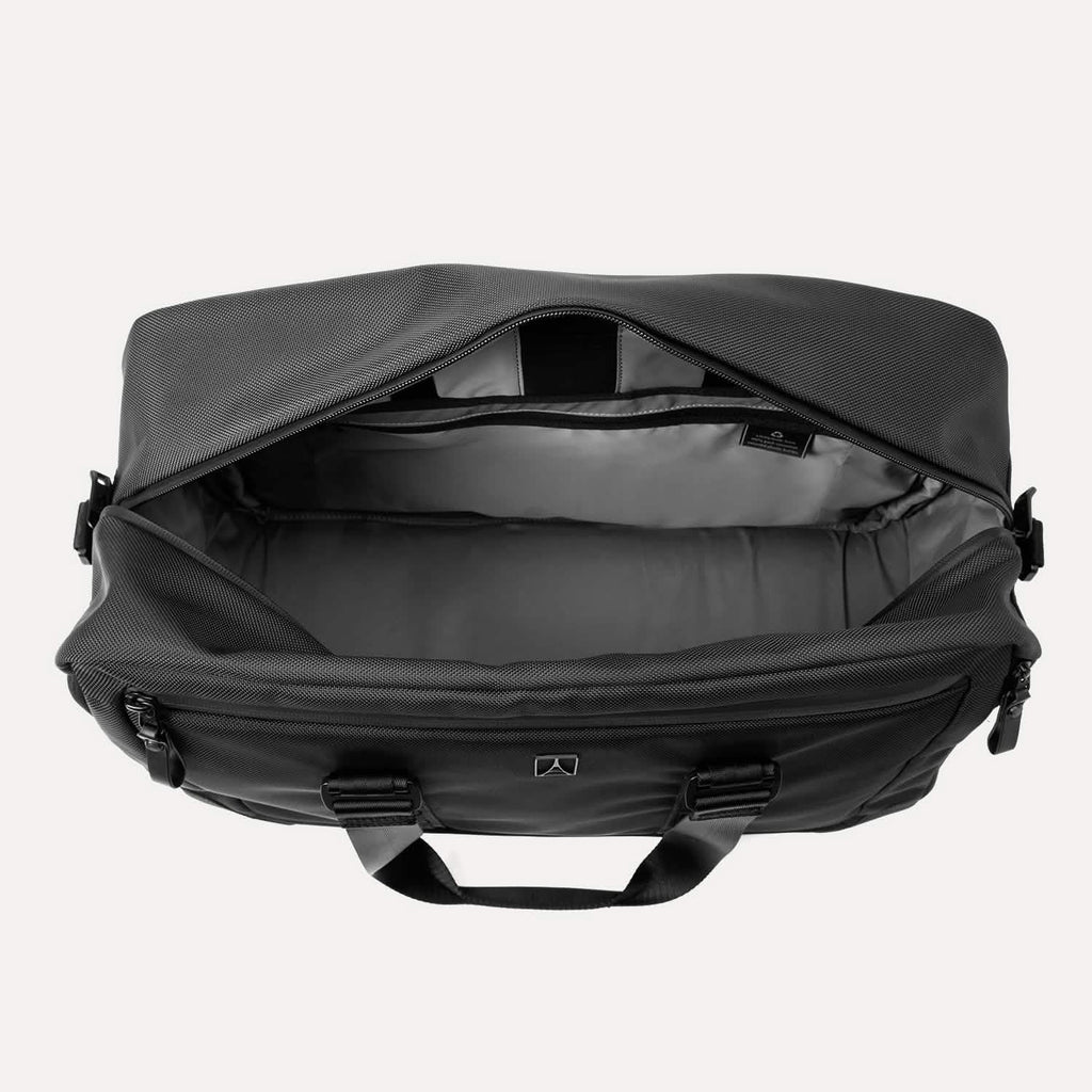 Top view of Travelpro Altitude Double Expansion Duffel in Jet Black with open main compartment and visible interior pockets.

