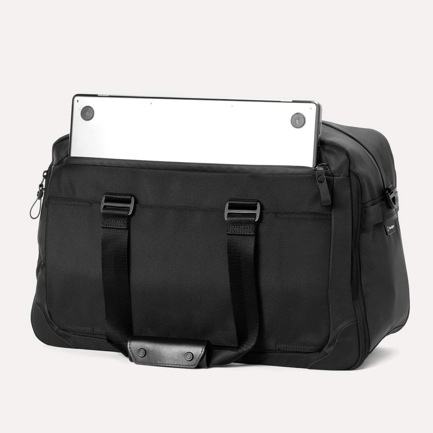 Back view of Travelpro Altitude Double Expansion Duffel in Jet Black with laptop partially tucked in rear zippered pocket.
