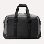  Front view of the Travelpro® Altitude™ Double Expansion Duffel in Falcon Grey, featuring dual carry handles with a padded grip, a large front panel, and a zippered pocket on the upper left.
