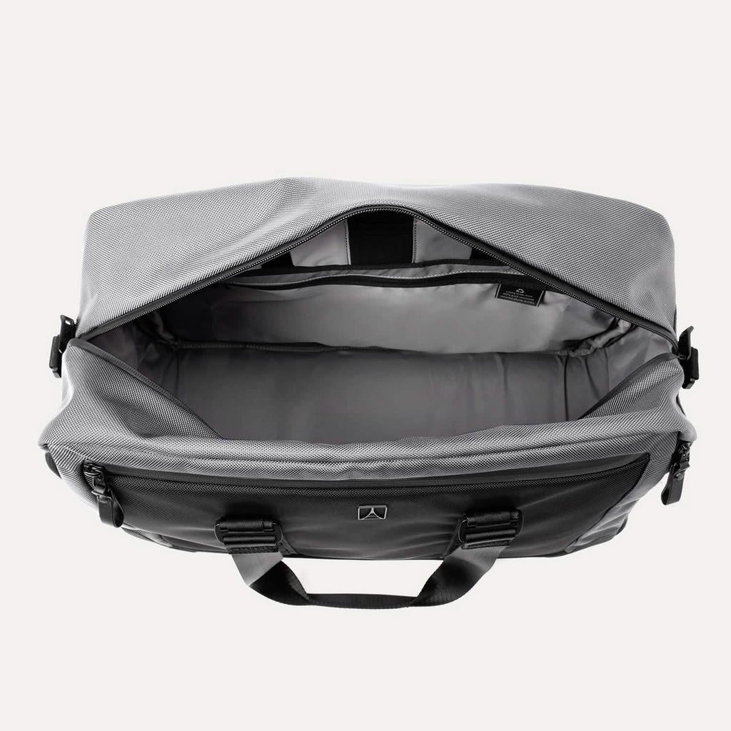  Travelpro® Altitude™ Double Expansion Duffel in Falcon Grey shown from above with the top zipper open, revealing a spacious main compartment