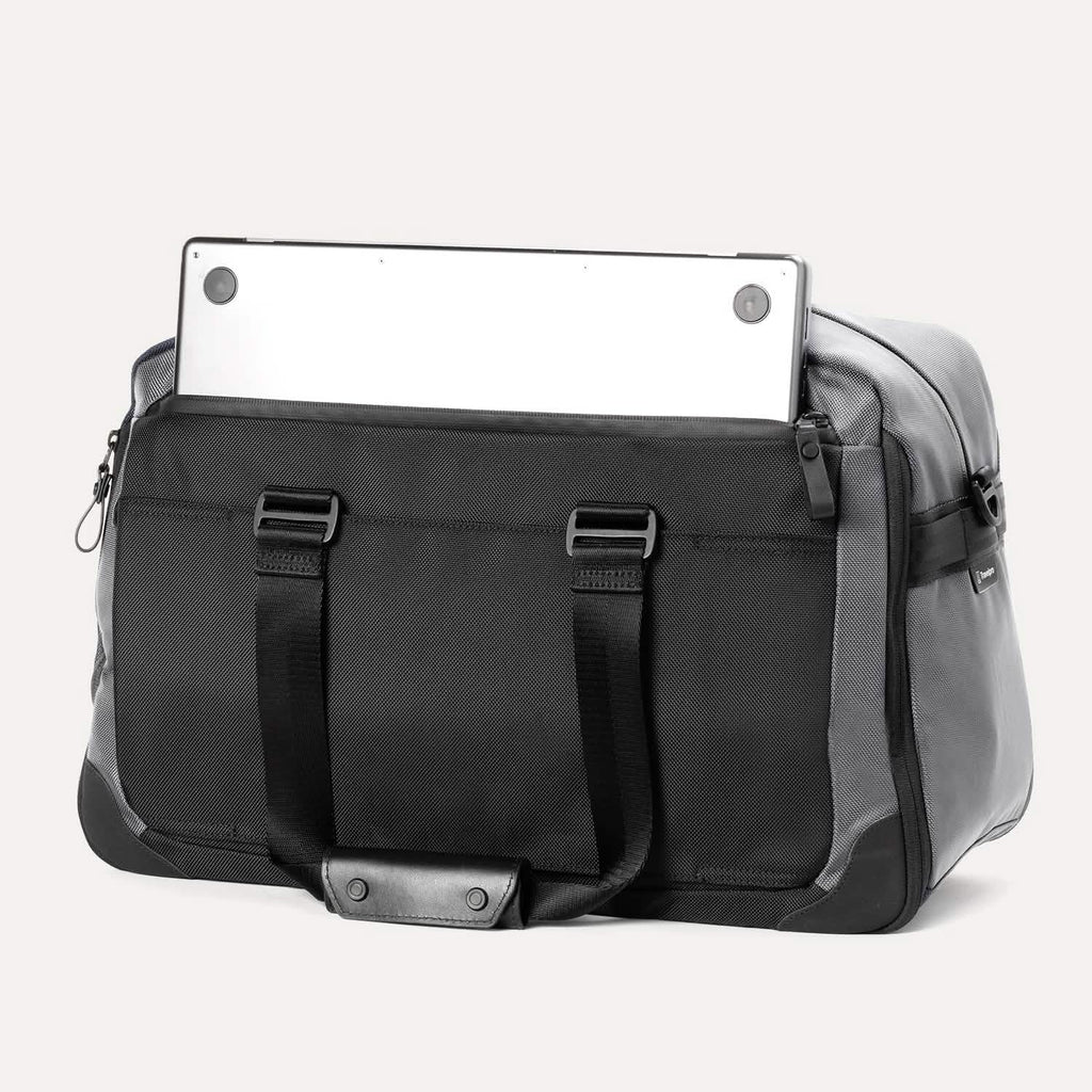 Rear view of the Travelpro® Altitude™ Double Expansion Duffel in Falcon Grey, showing an exterior zip pocket with a laptop partially inserted.







Ask ChatGPT
