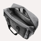 Top view of Travelpro Altitude Double Expansion Duffel in falcon grey, unzipped to show spacious interior and organizational pockets.
