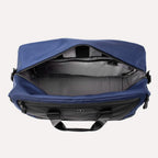 Interior view of Travelpro Altitude Double Expansion Duffel in Aviator Navy, showing spacious main compartment.
