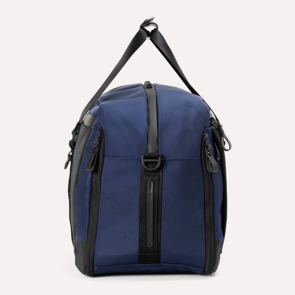 Side view of Travelpro Altitude Double Expansion Duffel in Aviator Navy, showing vertical zipper and adjustable strap.






Ask ChatGPT
