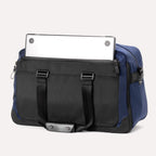Back view of Travelpro Altitude Double Expansion Duffel in Aviator Navy with laptop partially inside rear pocket.
