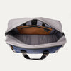 Open top view of the Travelpro® Altitude™ Double Expansion Duffel in Stellar Navy/Grey, showing the spacious main compartment with an interior zippered pocket and divider panel.