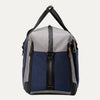 Side view of the Travelpro® Altitude™ Double Expansion Duffel in Stellar Navy/Grey, showing the side profile with zipper closures and carry handles 