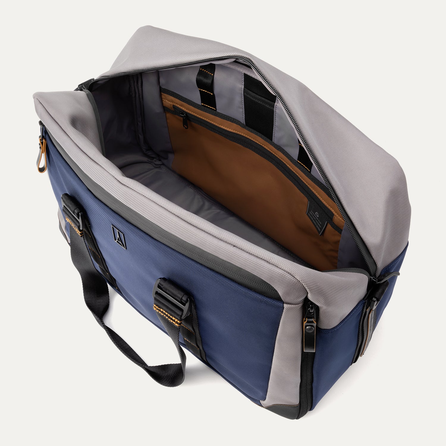 Open top view of the Travelpro® Altitude™ Double Expansion Duffel in Stellar Navy/Grey, showing a spacious main compartment with an interior zippered pocket, organizational sleeves, and contrast lining.
