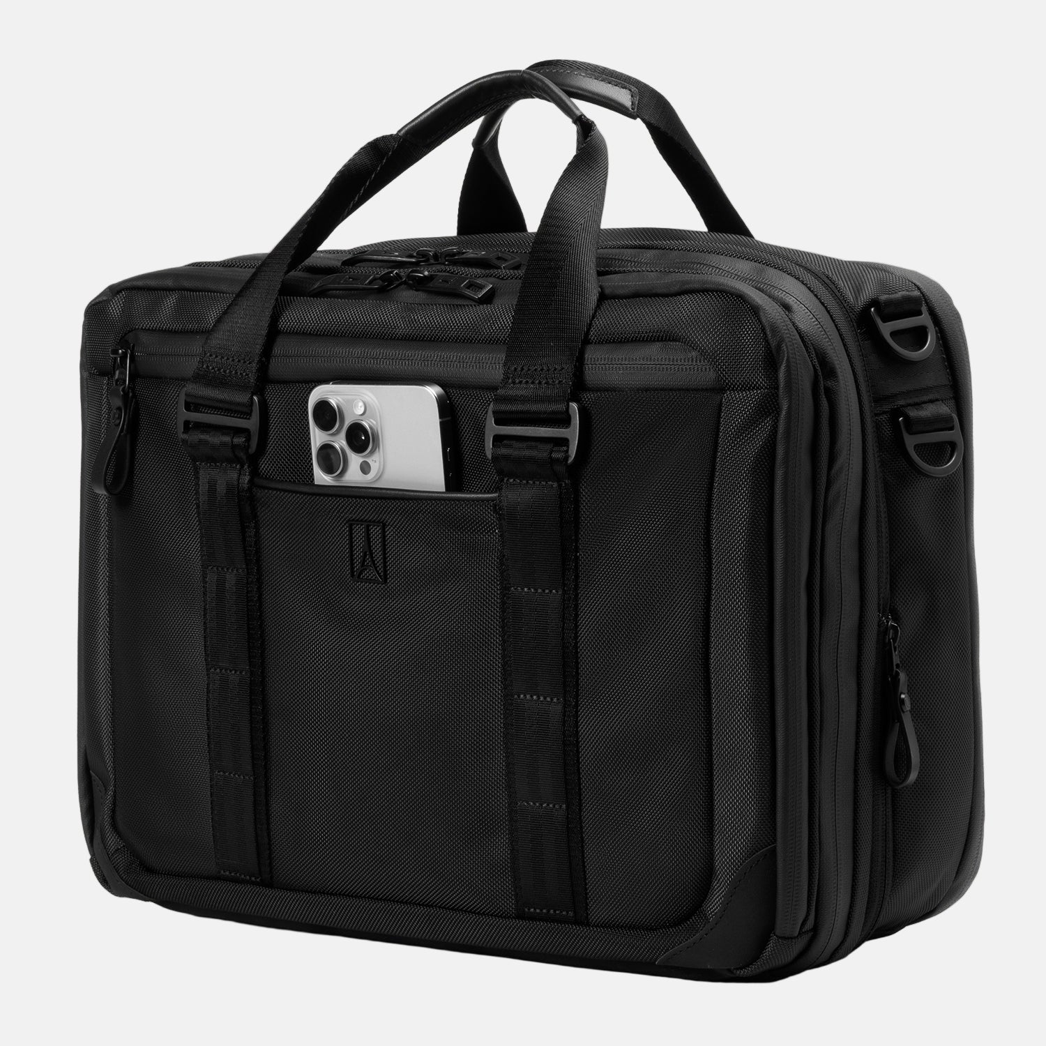 Travelpro® Altitude™ Full Expansion Brief in black, shown with dual top carry handles, vertical webbing accents, and a front slip pocket holding a smartphone. 