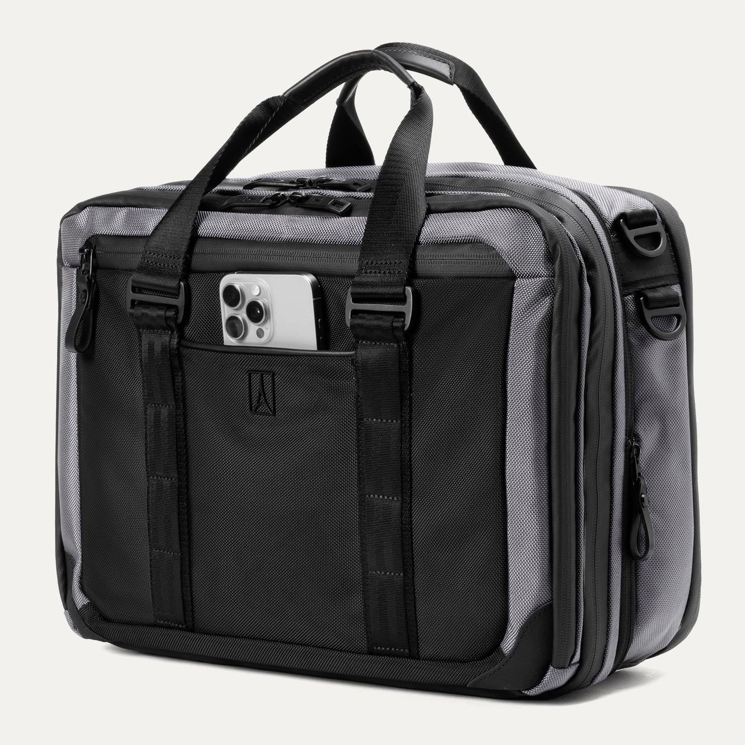 Slanted Front view of the Travelpro® Altitude™ Full Expansion Brief in Falcon Grey, featuring a smartphone in the front pocket, dual top handles, adjustable straps, and multiple zippered compartments.
