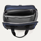 Top view of the Travelpro® Altitude™ Full Expansion Brief in Aviator Navy showing the rear compartment open, with a padded laptop sleeve and additional zippered and slip pockets for organized storage.