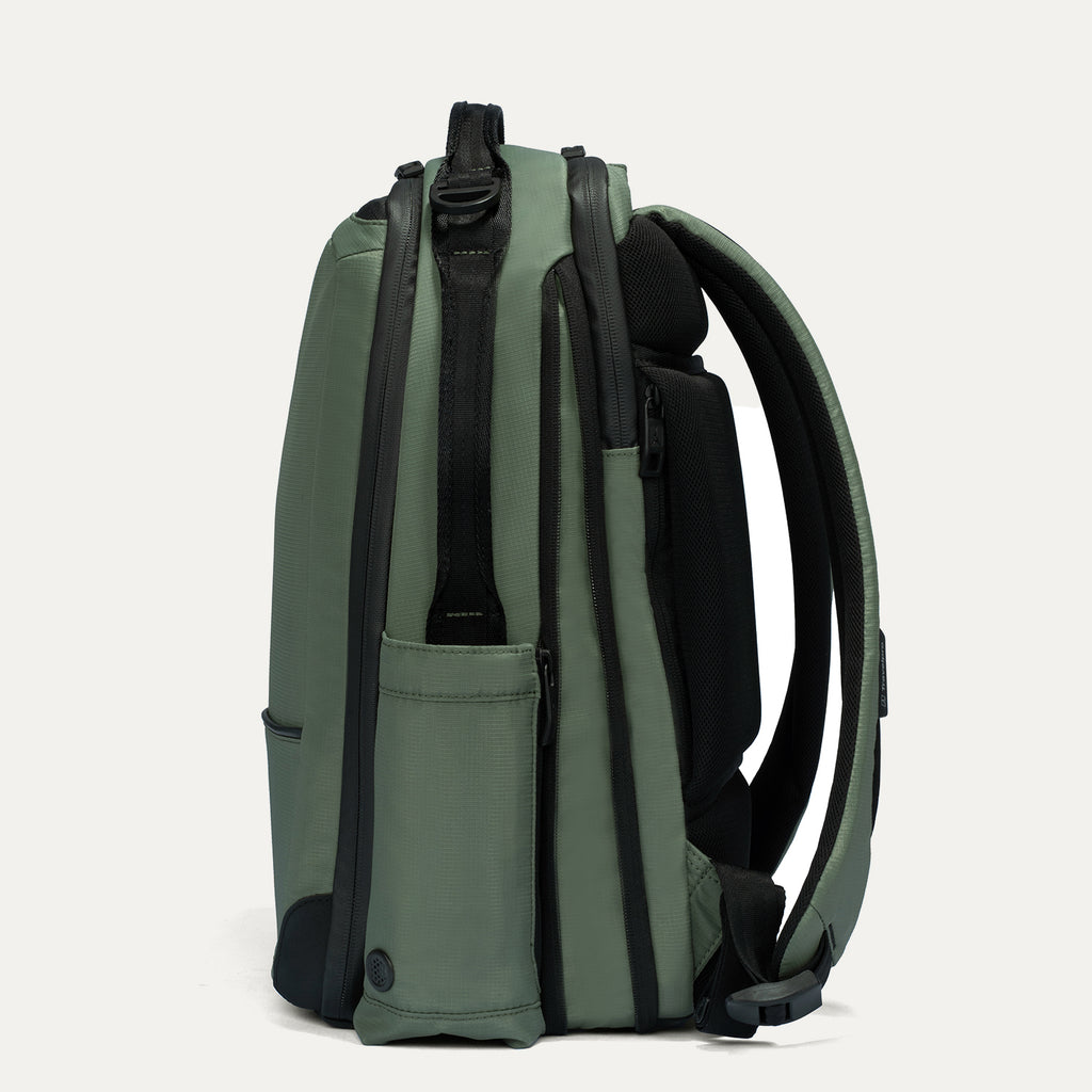 Green backpack with black straps on a white background