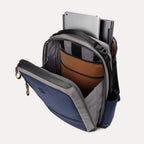 Interior view of the Travelpro Altitude Slim Expandable Laptop Backpack 20-24L in Stellar Navy and Grey, showcasing the spacious main compartment, dedicated padded tablet sleeve, and efficient internal organizational pockets.