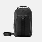 Front view of Travelpro Altitude Crossbody 6L in Black, showcasing zippered front pocket with daisy chain and top carry handle.
