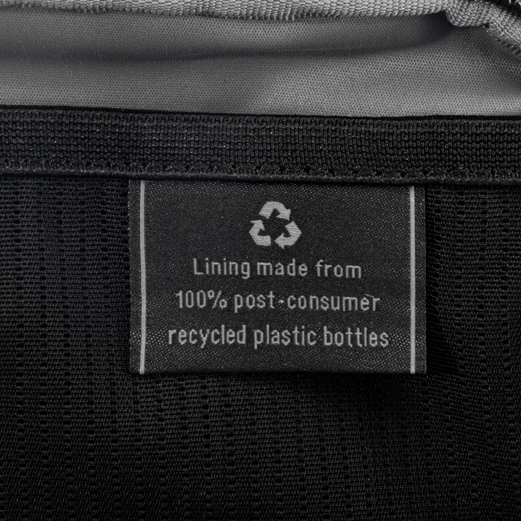 Close-up of interior tag showing that the lining is made from 100% post-consumer recycled plastic bottles.
