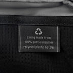 Close-up of interior tag showing that the lining is made from 100% post-consumer recycled plastic bottles.
