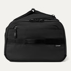 Side view of the Travelpro Altitude Convertible Duffel/Backpack in Jet Black, featuring streamlined handles and sleek paneling.
