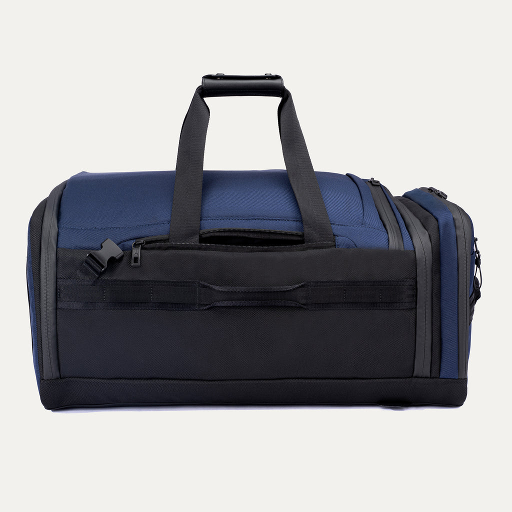 Rear duffel view of the Travelpro Altitude Convertible Duffel/Backpack in Aviator Navy, featuring backpack straps and top grab handle.
