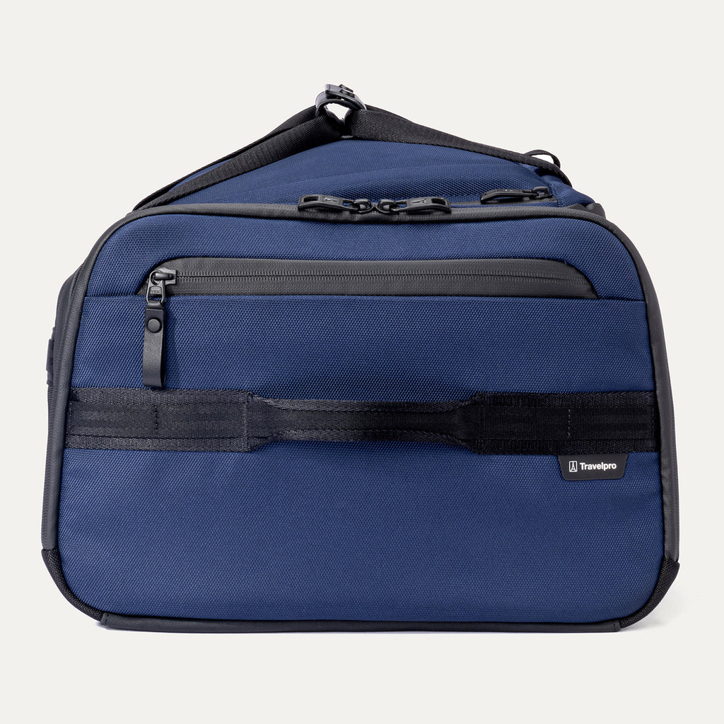 Side view of the Travelpro Altitude Convertible Duffel/Backpack in Aviator Navy, showing grab handle and waterproof zippered pocket.
