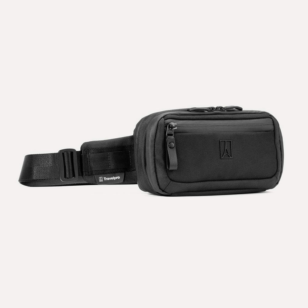 Travelpro Altitude Sling 2L in Jet Black, showing front zip pocket and adjustable strap with Travelpro tag.

