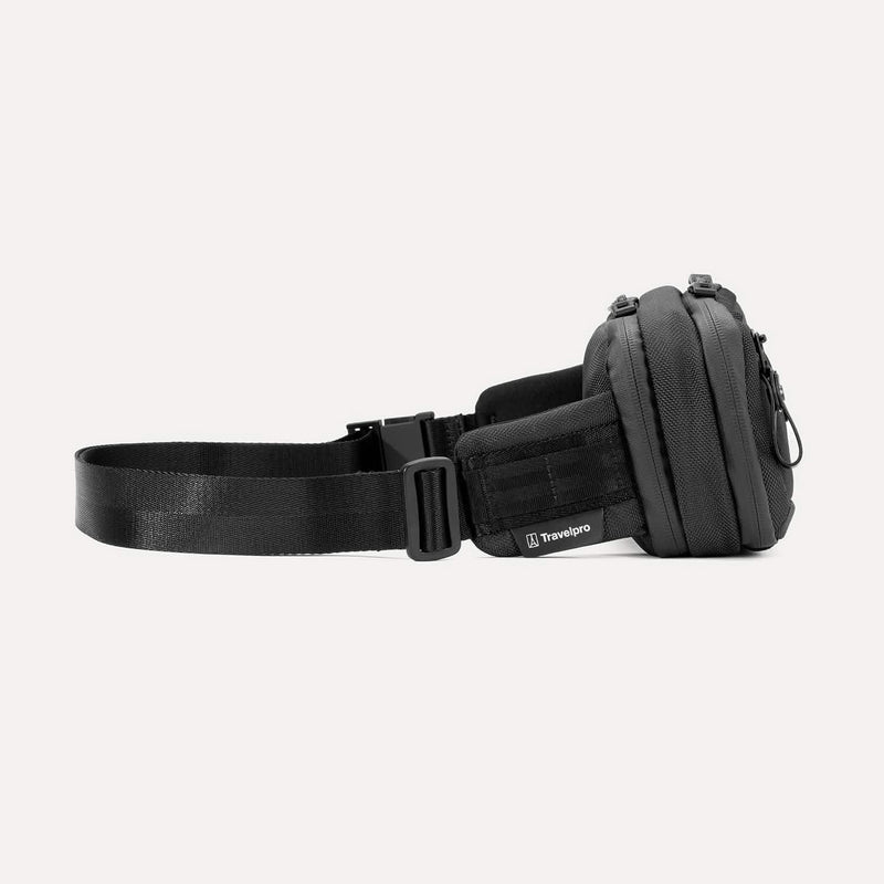 Side view of the Travelpro Altitude Sling 2L in Jet Black, showing Travelpro logo tab and adjustable buckle strap.

