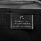 Close-up of interior tag showing that the lining is made from 100% post-consumer recycled plastic bottles.
