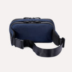 Rear view of the Travelpro Altitude Sling 2L in Aviator Navy, showing adjustable buckle strap and dual top zippers.

